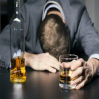 alcohol-200-200 Man drunk on alcohol passed out at table