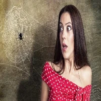 Fear of Spiders Hypnosis-200-200 Woman with fear of spiders looking scared at web