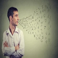 stuttering-200-200 Stuttering man looks at jumble of letters leaving his mouth